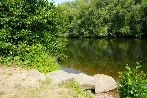 Tranquil River With Green Trees Reflecting In Water In Farndon, Nottinghamshire, Stock Photos