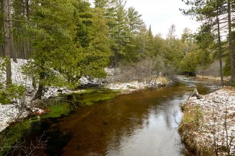 Tranquil river in a winter landscape Stock Photos