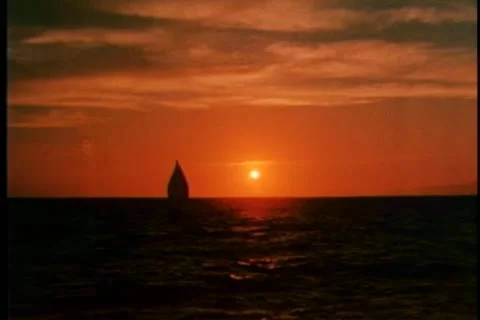 Tranquil scene of boat sailing in an open ocean at sunset Stock Footage 25207823