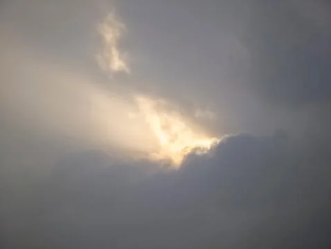 Tranquil Scene Showcasing Radiant Sunlight Breaking Through Heavy Overcast .. Stock Photos