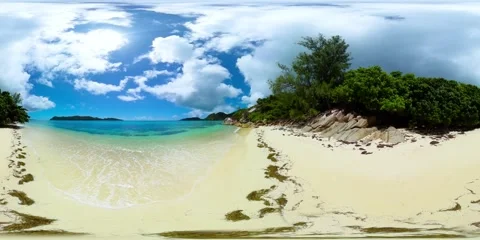 A tranquil scene of soft sand, turquoise waters. Praslin, Seychelles. Stock Footage 311037819