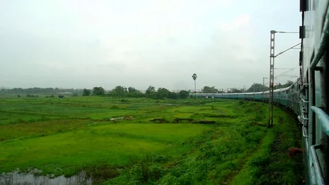 Tranquil Scenic greenery View from fast moving Indian train window, Mumbai India Stock Footage 99171178