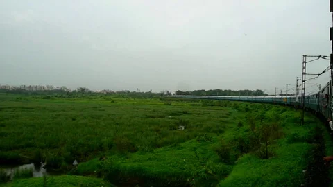 Tranquil Scenic greenery View from fast moving Indian train window, Mumbai India Stock Footage 99171210
