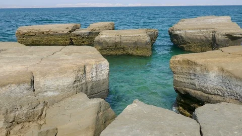 Tranquil sea waters in between rock stones Stock Footage 111665470