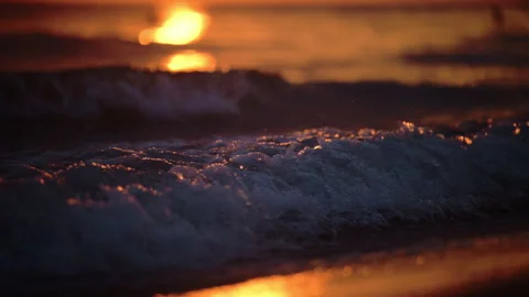 Tranquil sea waves at sunset with dramatic light and atmospheric mood Stock Footage 325991627