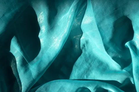 Tranquil Seas background - close-up of wavy turquoise textile Stock Photos