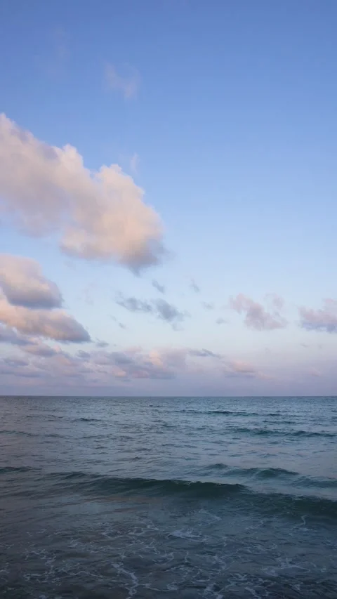 Tranquil Seascape with Gentle Waves Under Clear Blue Sky Stock Footage 301185722