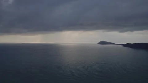 Tranquil Seascape, Sunlight Piercing Stormy Clouds Stock Footage 260598864