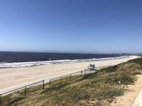 Tranquil Seaside View With Waves Gently Rolling Onto the Shore Stock Photos