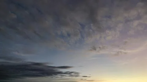 A tranquil sky at dawn. The top half is a rich, dark blue while the bottom .. Stock Photos