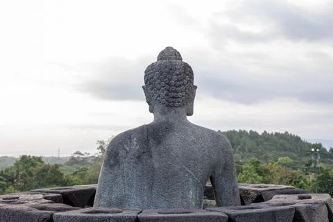 Tranquil Stone Statue of Buddha Back View at Borobudur Temple Java Stock Photos