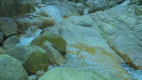 Tranquil Stream Flowing Through Rocky Terrain | Nature's Calming Sounds Stock Footage 286937916