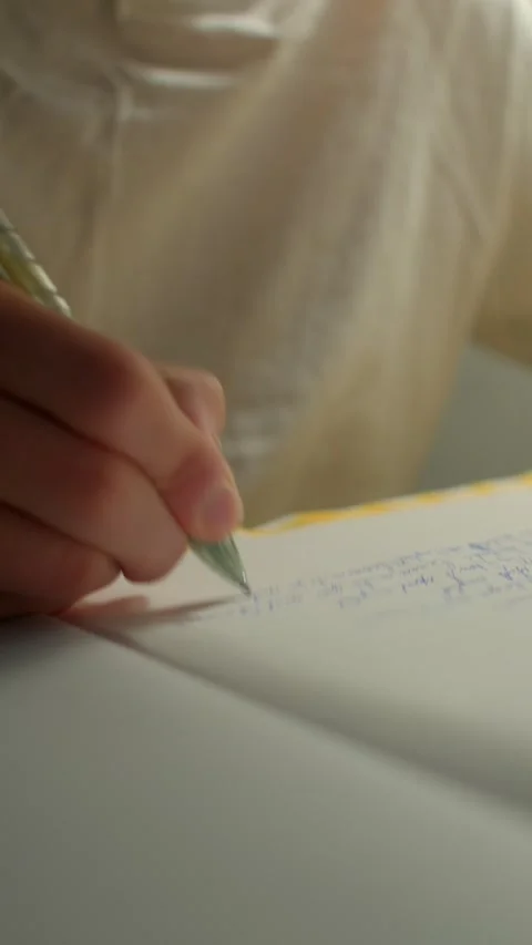 Tranquil study area featuring handwritten pages and gentle illumination Stock Footage 325071381