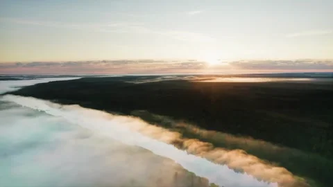 Tranquil Summer Dawn. Sunlight Softly Filtering Through Fog-Enshrouded River Stock Footage 257784482