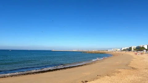 Tranquil Summer Day at an Empty Beach in Monte Gordo, Portugal Stock Footage 284767940