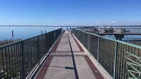 Tranquil Summer Day: Walking on a Pier by the Lake Stock Footage 295663778