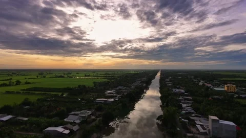 Tranquil sunrise aerial view over quiet river and countryside village Stock-Footage 342390997
