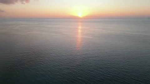Tranquil sunrise light over calm ocean waters Stock Footage 346262564