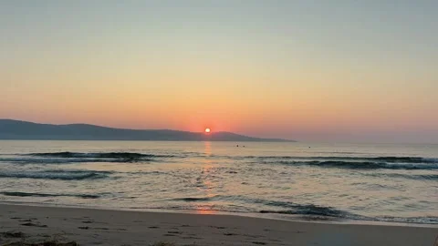 Tranquil sunrise over quiet coastal Stock Footage 336010459