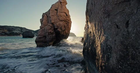 Tranquil Sunset Ocean Waves Breaking on Rocky Coast - Nature's Beauty Stock Footage 275835471