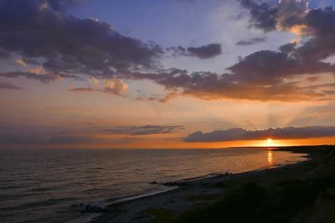 Tranquil Sunset over Dramatic Ocean Horizon Stock Photos