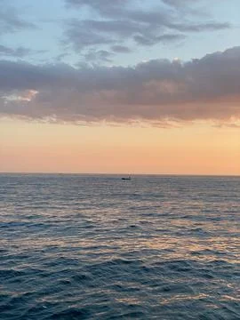 Tranquil Sunset Over Rippling Waves Stock Photos