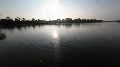 Tranquil Sunset Over a Serene Riverside Landscape Video stock 312912610