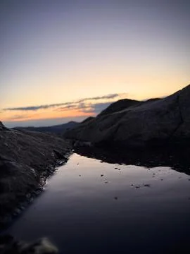 Tranquil Sunset Reflected in Mountain Rock Pool Stock Photos