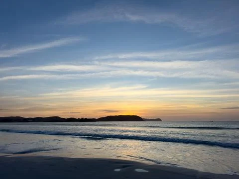 Tranquil sunset scene on the beach Stock Photos