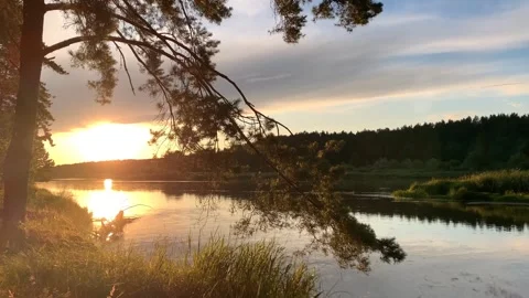 Tranquil sunset scene over a calm river Vídeo Stock 296440376