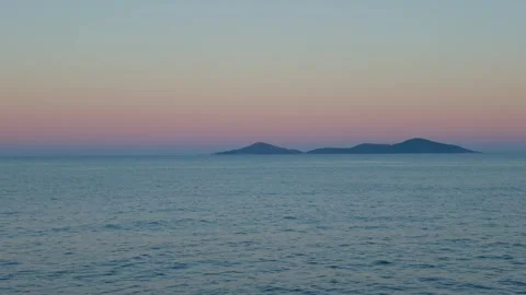 A tranquil sunset view over the Aegean Sea from Patitiri, Alonnisos, Greece. No Stock Footage 346688655
