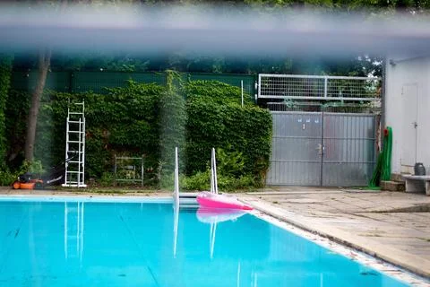Tranquil Swimming Pool with Pink Float Stock Photos