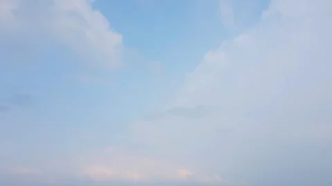 A tranquil timelapse capturing the beauty of white clouds gently Stock Footage 303473361