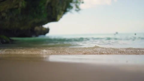 Tranquil tropical beach, gentle waves, harmony, relaxation under clear blue sky Stock Footage 279971219
