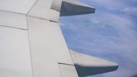 Tranquil View From Airplane Wing Soaring Above Fluffy Clouds During Bright Day Stock Footage 301913356