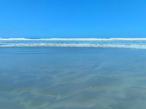 Tranquil view of the ocean coast Stock Photos
