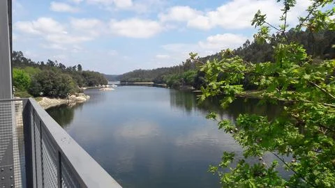 Tranquil view of the river from the metal railing Stock Photos