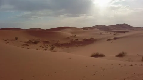 Tranquil view of Sahara Desert dunes in Merzouga, Morocco, under a partly Stock Footage 332133893