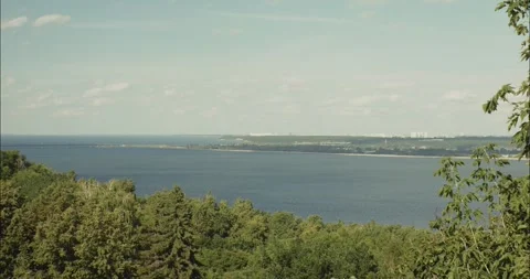 Tranquil Volga river view overlooking lush green forest Stock Footage 304563053