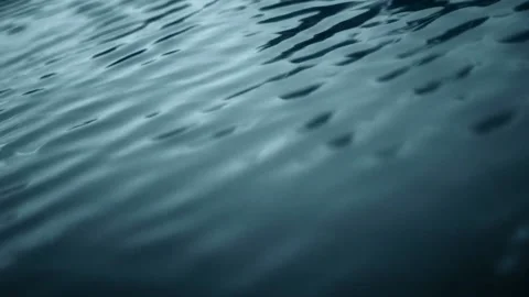 Tranquil water flowing through a lake Stockbeeldmateriaal 208090426