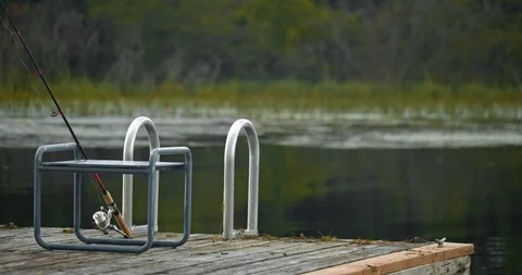 Tranquil water in a small bay overlooking trees and sky Stock Footage 120699644