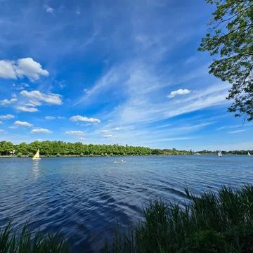 The Tranquil Waters are Gently Lapping Under a Bright and Clear Blue Sky High Stock Photos