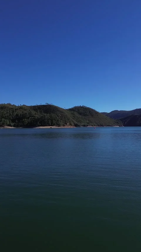 Tranquil Waters of Barragem de Castelo do Bode: Boat Ride Through Serene Landsca Stock Footage 248081938