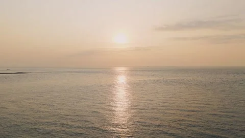 Tranquil wide shot of a sunset over the calm sea at Erquy, Brittany, France. Stock Footage 346665027