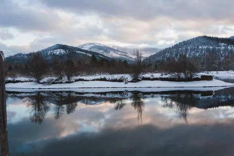 Tranquil Winter Landscape: Reflections in cold calm Lake Stock Photos