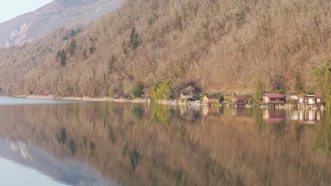 A tranquil winter scene at Lake Aiguebelette in Savoie, France, featuring a row Stock Footage 346676596