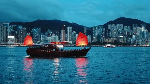 A tranquil yet vibrant scene of traditional Chinese junk boats gliding through Stock Footage 338280341