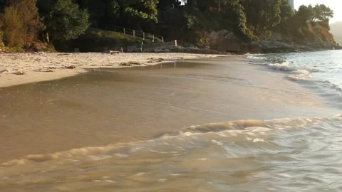 The tranquility of a Cantabrian beach during the last hours of sunset Stock Footage 320808186