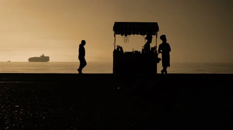 Tranquility Cinematic Slow Motion scene of Silhouettes of ordinary People Stock Footage 57262585