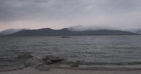 The tranquility of Lake Sevan is evident in this image, where the vast expanse Stock Footage 252467206